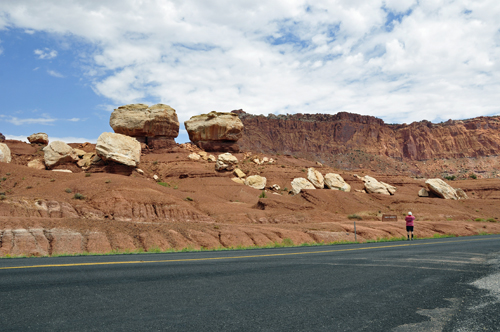 Lee Duquette stands by the road to photograph the Twin Rocks