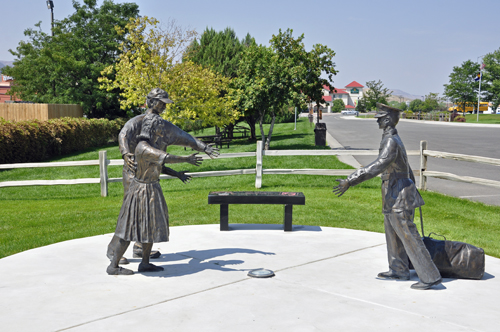 life-size sculpture of soldier being welcomed home