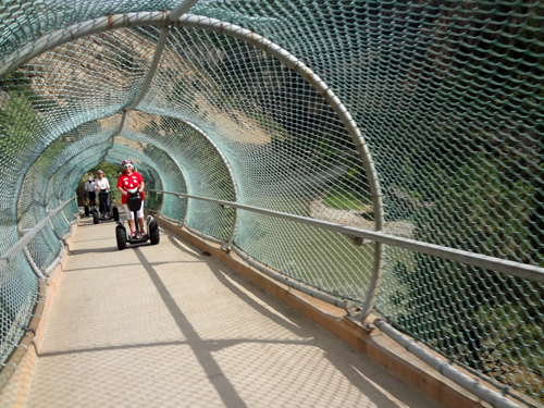 Karen Duquette going through the pedestrian / bicycle bridge