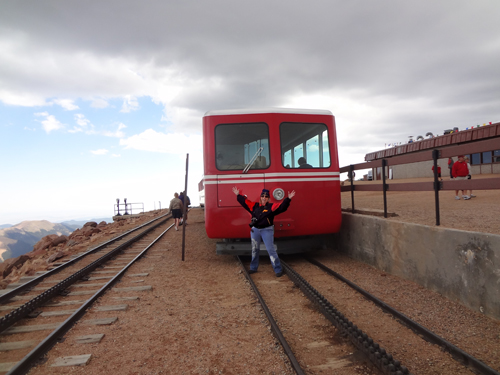 Karen Duquette on the tracks in front of the Manitou cog train