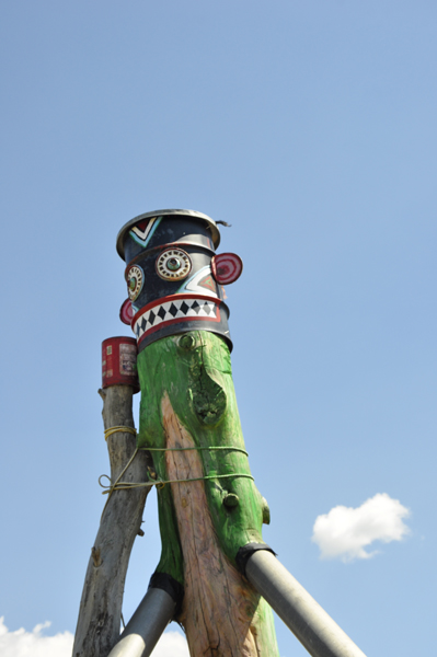 green totem pole at  Dave Sipes Folk Art