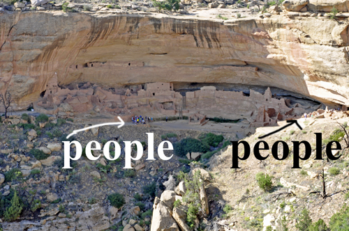 people touring the Long House cave dwellings