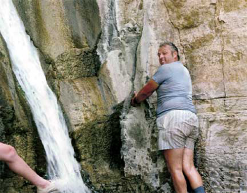 Lee Duquette under the cold waterfall