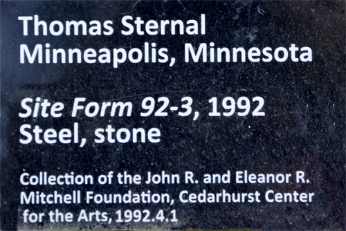 sign about the art sculpture made of steel and stone