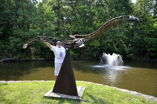 Lee Duquette by the art sculpture Time Flight