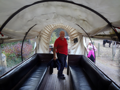 Lee Duquette exits the covered wagon