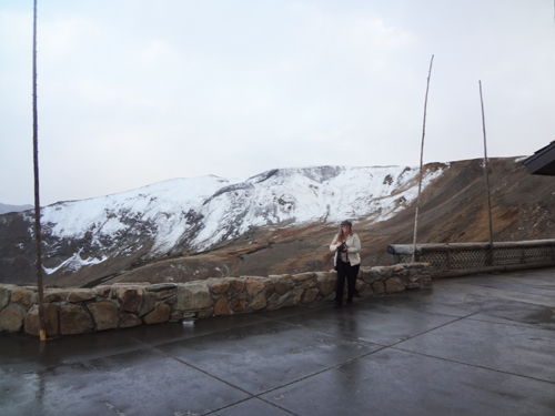 Karen Duquette in the snow Looking out over the ledge at the Alpine Visitor Center