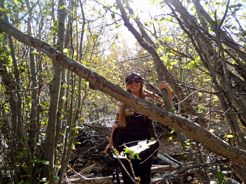 Karen Duquette plays in the woods