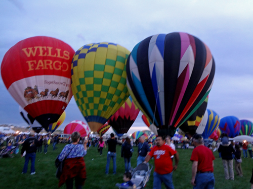 hot air balloons and many people