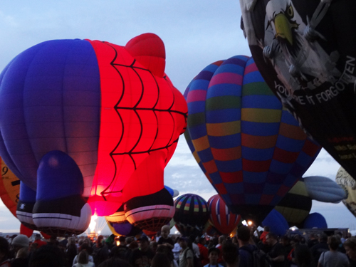 hot air balloons and many people