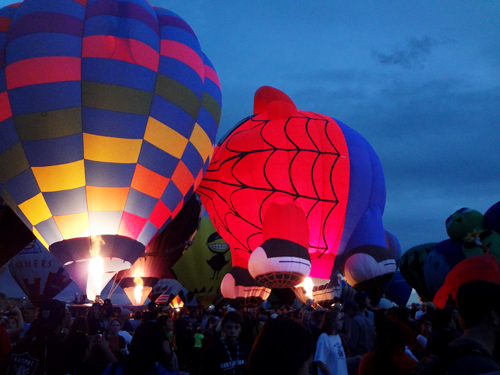 hot air balloons and many people