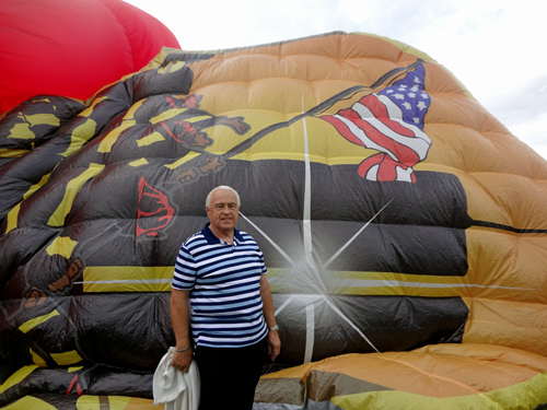 Lee Duquette by a partially blown-up hot ait balloon.