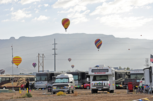 hot air balloons drift right over the campground