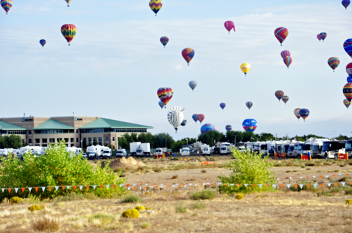 hot air balloons drift right over the campground