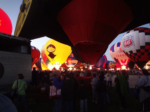 Retro Bird glowing with other hot air balloons