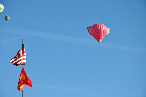 a flying pink elephant