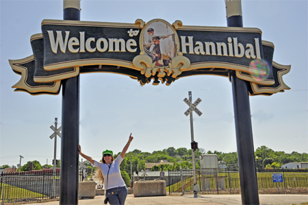 Karen Duquette by the Hannibal sign and railroad