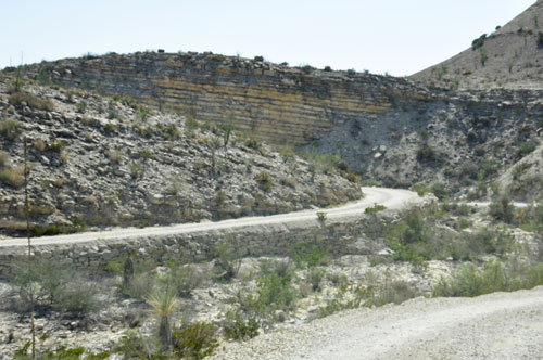 narrow, curvy, bumpy dirt road