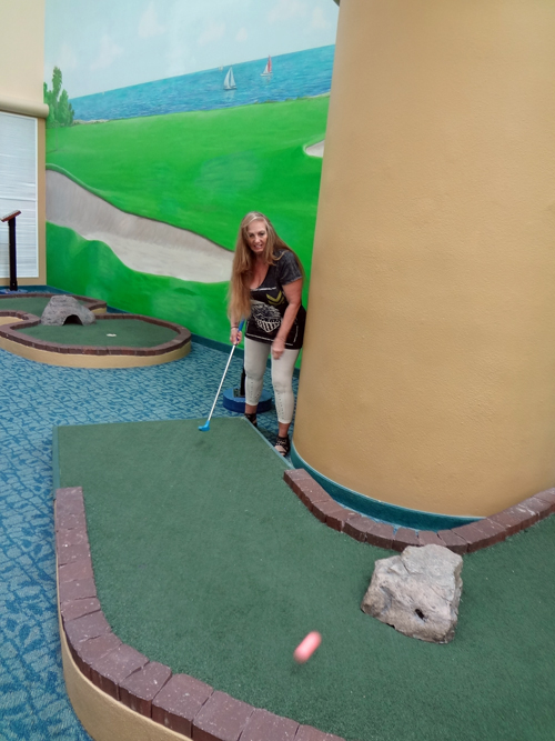 Karen Duquette  playing miniature golf