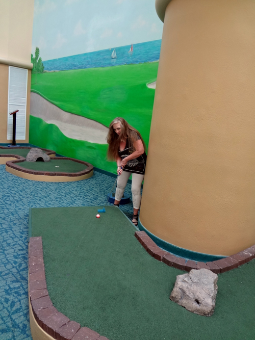 Karen Duquette  playing miniature golf