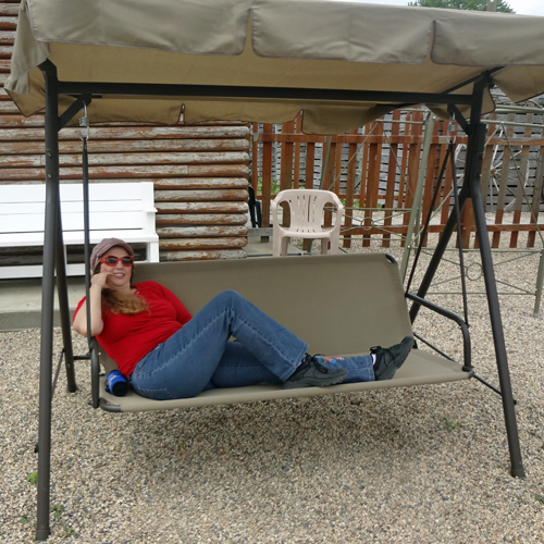 Karen Duquette takes a break on the swing