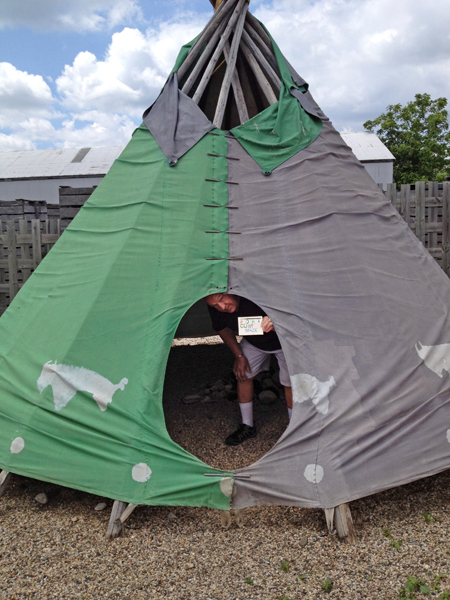 Lee Duquette in the teepee at Fort Custer Maze