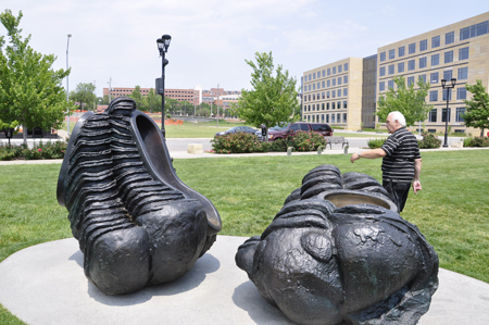 Lee Duquette near a sculpture by Tony Cragg