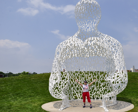 Karen Duquette inside sculpture by Jaume Plensa