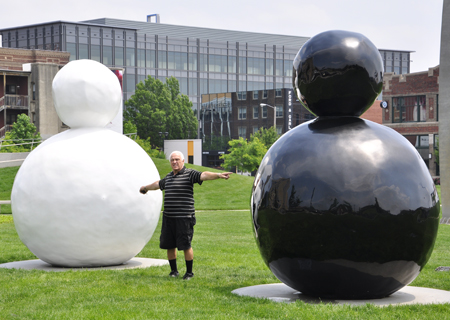 Lee Duquette near sculptures by Gary Hume