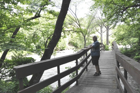 Lee Duquette on a bridge over the Redwood River