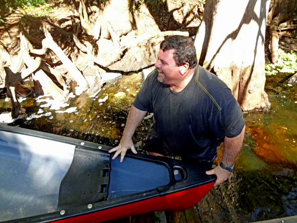 John Smythers uprighting the canoe