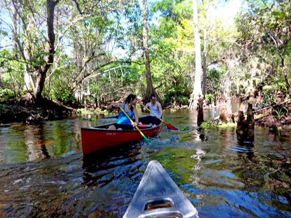 paddling the canoe around a corner