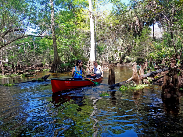 paddling the canoe around a corner