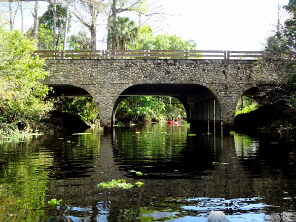 canoe ready to go under the bridge on Loxahatchee River at Rivverbend Park in Jupiter