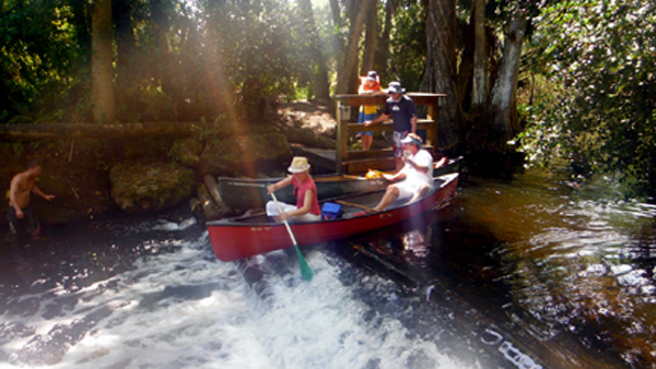 a canoe part way in the air