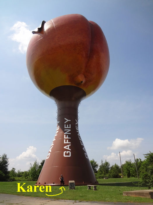 Karen Duquette under The Peachoid in 2013