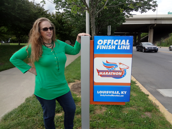 Louiville marathon official finish line sign and Karen Duquette