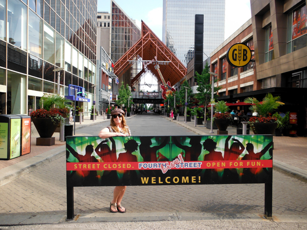 Karen Duquette at the  Fourth Street Live sign