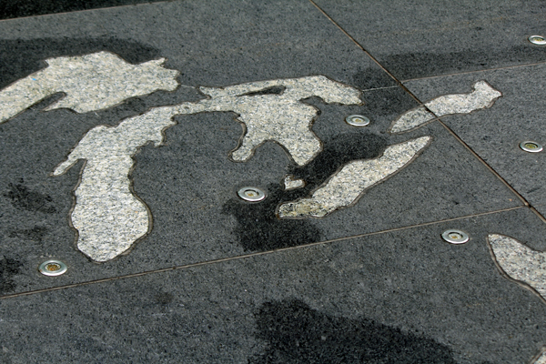 Shapes like continents on the ground outside the GM Building