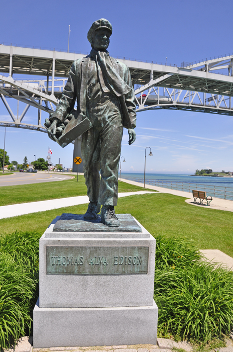 Statue of a Young Thomas Edison in front of the Blue Water Bridge