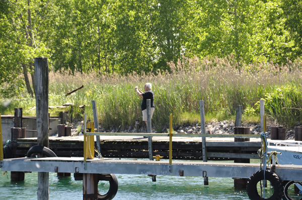 Lee walking on the dock to get another view of the ships.