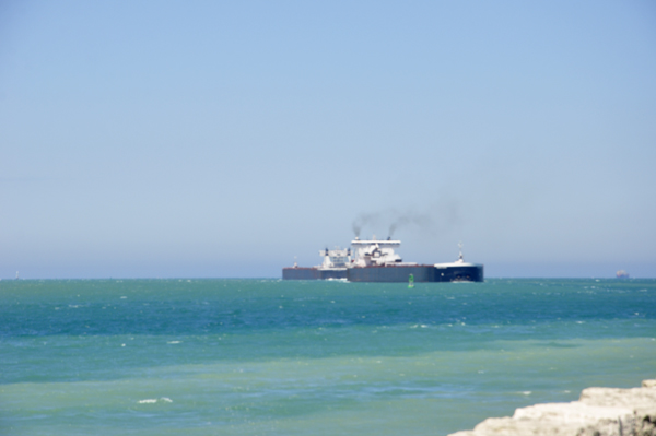 Two barges going in opposite directions, pass each other.