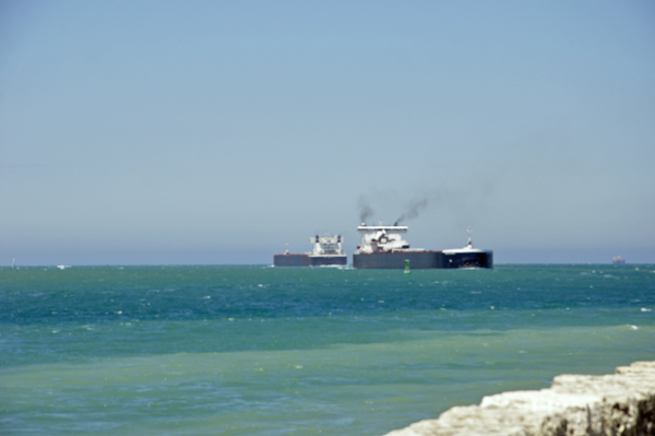 Two barges going in opposite directions, pass each other.