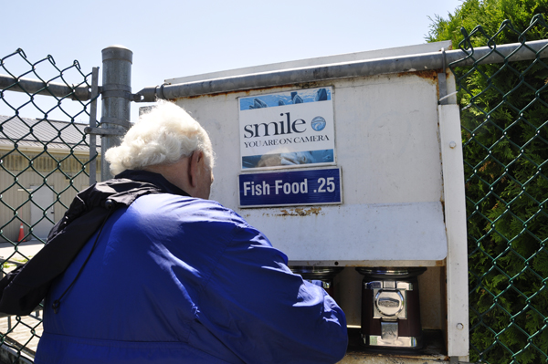 Lee Duquette buying fish food to feed the fish