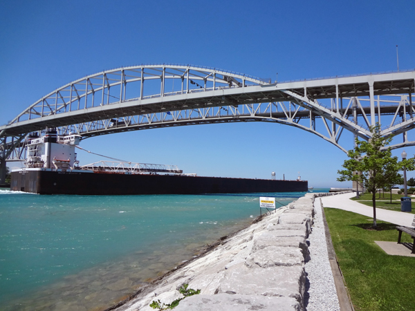 barge going under the Bluewater Bridge at Point Edward