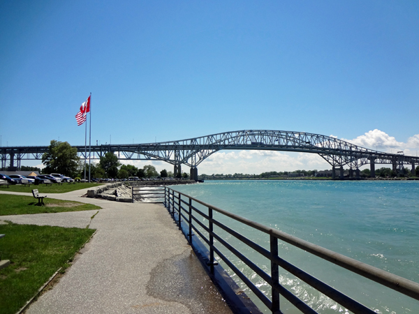 the Bluewater Bridge and USA flag and Canadian Flag