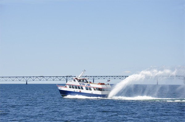 a jet boat with a big rooster tail