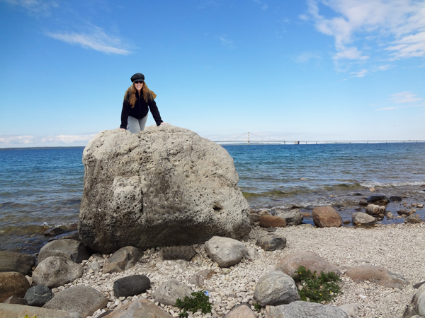 Karen Duquette climbs up onto the famous 'Big Rock" 