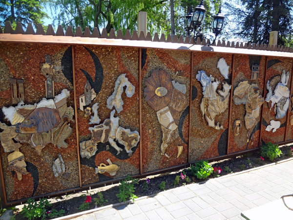 wall of carving outside the Legs Inn