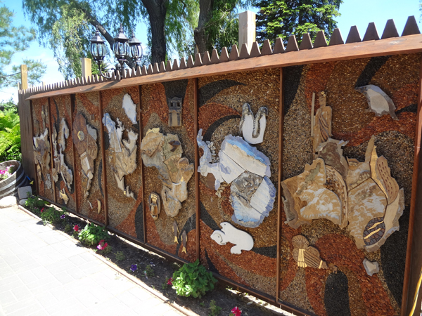 wall of carving outside the Legs Inn